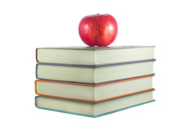 beyaz zemin üzerine kırmızı elma ile kitaplar