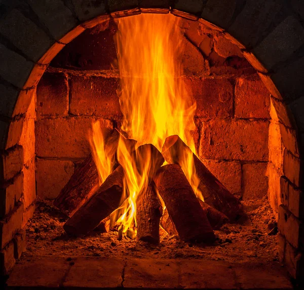 A fire burns in a fireplace — Stock Photo © samurkas 141647540