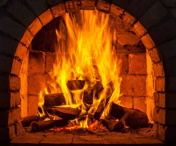 A fire burns in a fireplace — Stock Photo, Image