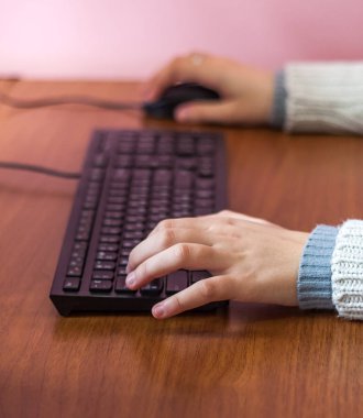 Woman hands typing on personal computer (pc) keyboard. clipart