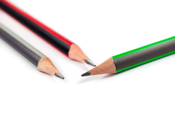 Три олівці на білому тлі — стокове фото