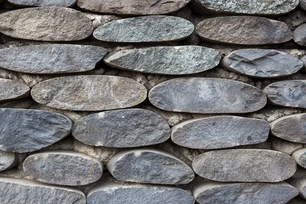 Primo piano di uso muro di pietra per l'edilizia e progettista — Foto Stock