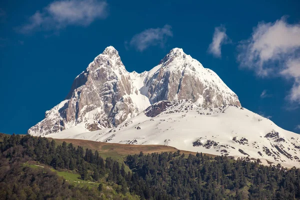 Peak of mount Ushba in Caucasus Mountains, Svanetia region in Ge — Stock Photo, Image