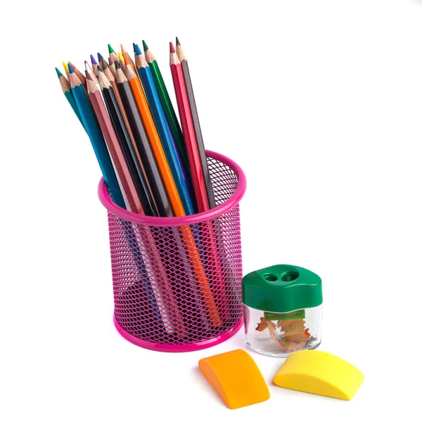 Colored pencils in the basket, Eraser and pencil sharpener on wh — Stock Photo, Image