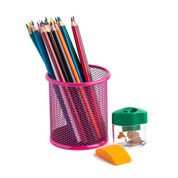 Colored pencils in the basket, Eraser and pencil sharpener on wh — Stock Photo, Image