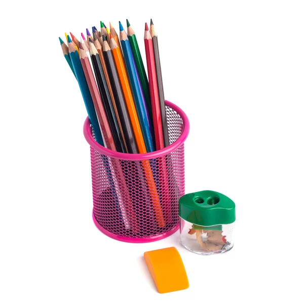 Colored pencils in the basket, Eraser and pencil sharpener on wh — Stock Photo, Image