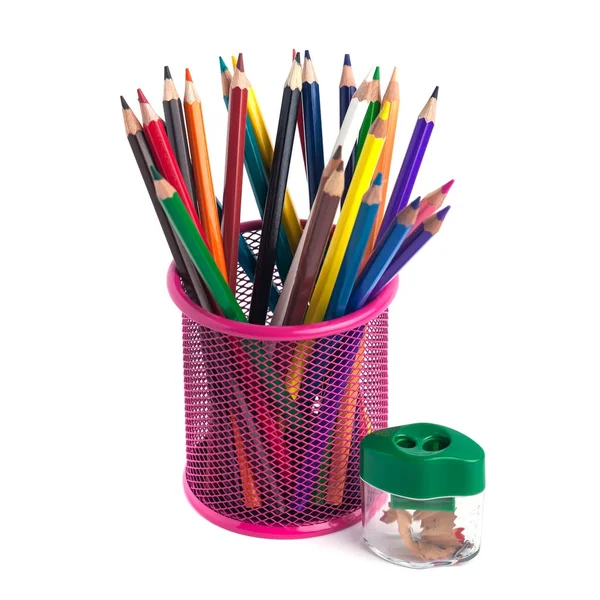 Colored pencils in the basket and Pencil sharpener on white back — Stock Photo, Image
