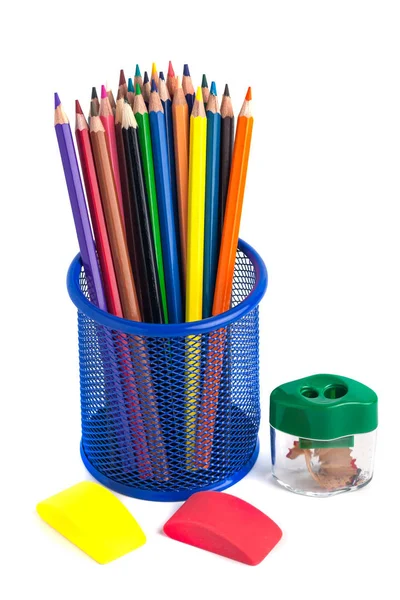 Colored pencils in the basket, Eraser and pencil sharpener on wh — Stock Photo, Image