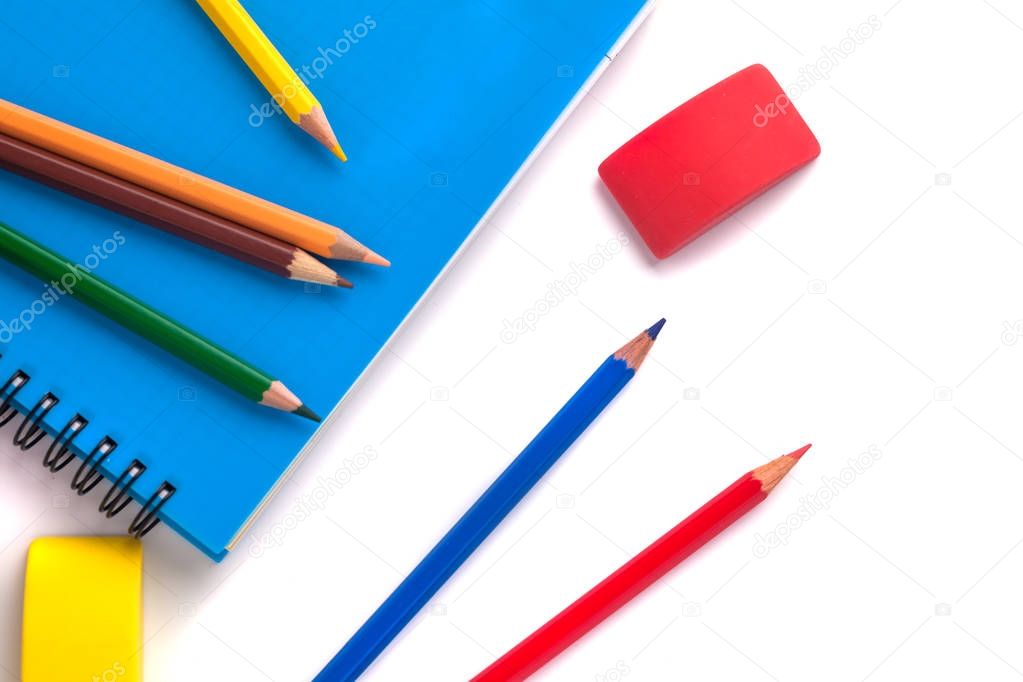 colored pencils, Eraser and pencil sharpener on white background