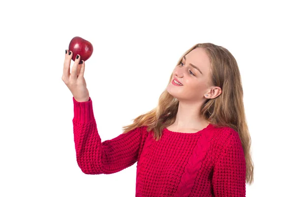 Hübsches blondes Mädchen mit rotem Apfel in der Hand, weißem Hintergrund — Stockfoto