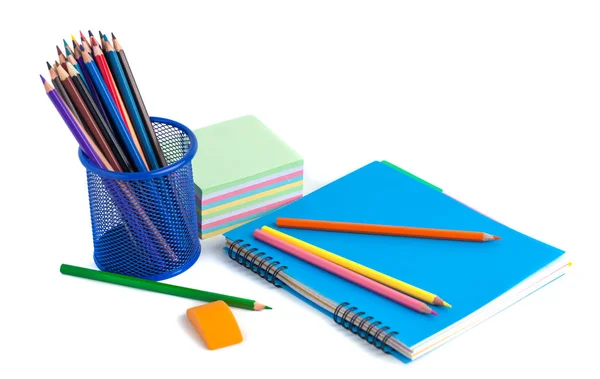 Colored pencils in the basket, Eraser and notebook on white back — Stock Photo, Image