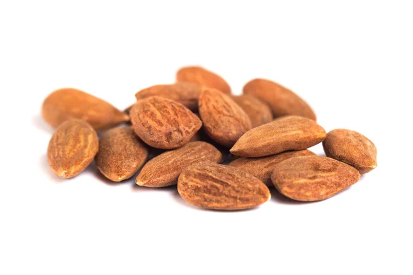 Heap of brown roast almonds on white background — Stock Photo, Image