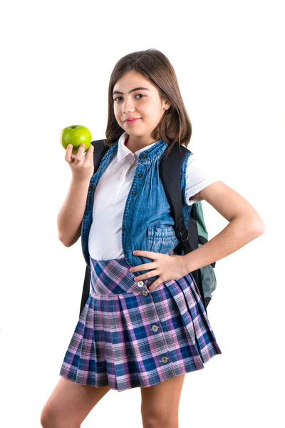 Söt skolflicka med apple på vit bakgrund — Stockfoto
