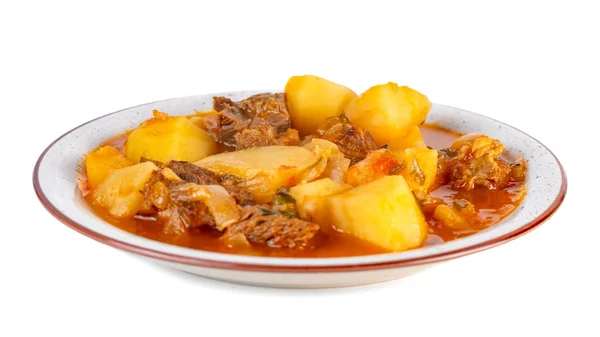 Tasty winter stew with meat and vegetables on a plate. white background — Stock Photo, Image