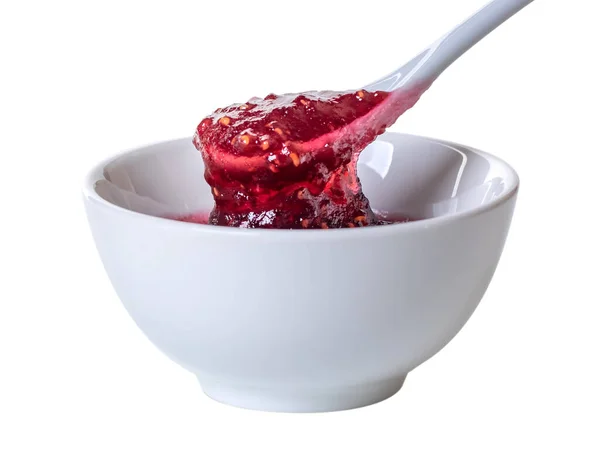 White ceramic spoon and bowl of blackberry jam on white background — 스톡 사진