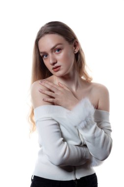 Portrait of beautiful blonde female model on white background.