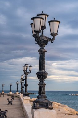 Bari seafront lights. Coastline and Twilight purple and blue sky.
