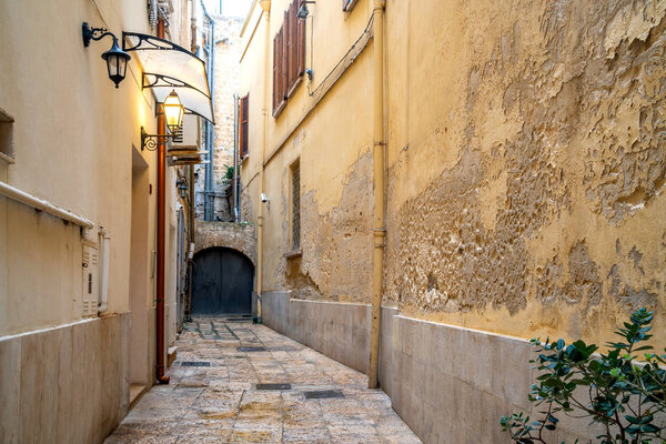View of a narrow street in the Italian city Bari. Travel.