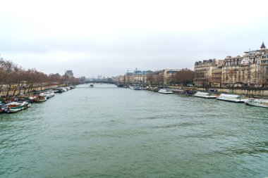 Paris, France - January 20, 2019: view on the Senna river with bridge and ship