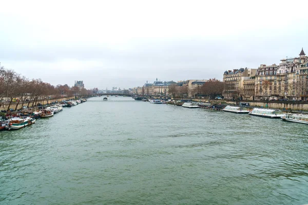 Paris, France - January 20, 2019: view on the Senna river with bridge and ship — ストック写真