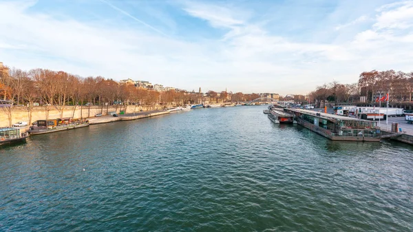 Paris, France - January 16, 2019: view on the Senna river with bridge and ship. — Stok fotoğraf