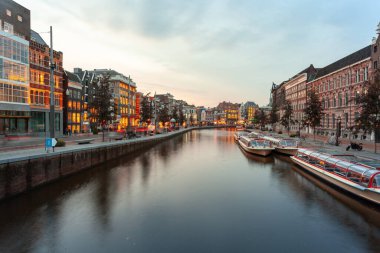 Amsterdam, Netherlands - October 14, 2019: Famous landscape in Amsterdam with unique building at night