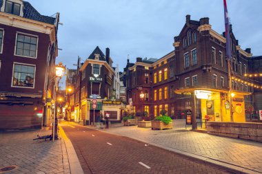 Amsterdam, Netherlands - October 14, 2019: Famous landscape in Amsterdam with unique building at night