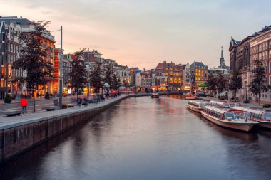 Amsterdam, Netherlands - October 14, 2019: Famous landscape in Amsterdam with unique building at night
