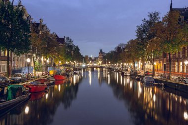 Amsterdam, Netherlands - October 14, 2019: Famous landscape in Amsterdam with unique building at night