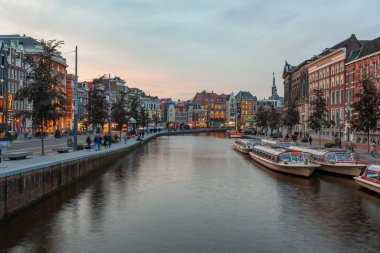 Amsterdam, Netherlands - October 14, 2019: Famous landscape in Amsterdam with unique building at night