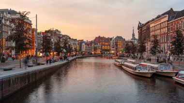 Amsterdam, Netherlands - October 14, 2019: Famous landscape in Amsterdam with unique building at night