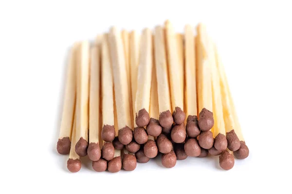 A pile of matches on a white background. Wooden matches with sulfur for lighting a fire. Object