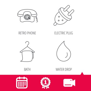 Retro telefon, banyo havlusu ve elektrik fişi.