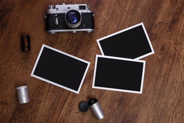 Vintage photo camera. Blank photo frames.