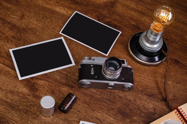 Vintage photo camera. Blank photo frames.