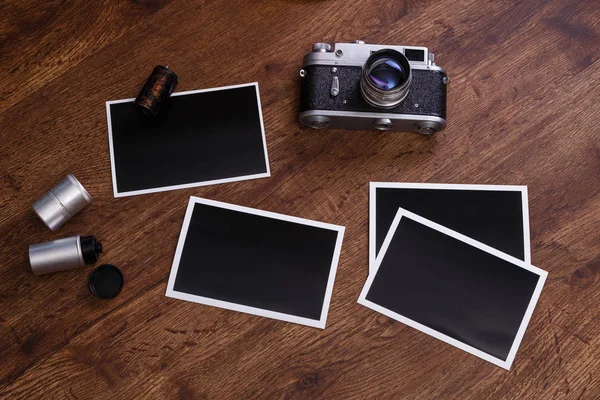 Vintage photo camera. Blank photo frames.