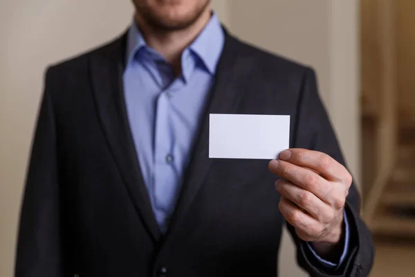 stock image Businessman holding visit or business card.