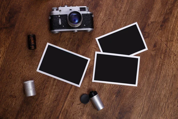 Vintage photo camera. Blank photo frames.