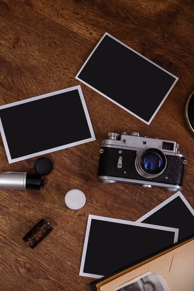 Vintage photo camera. Blank photo frames.