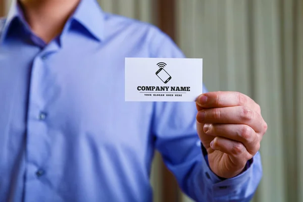 Man holding visit or business card.