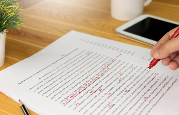 stock image proofreading paper on table