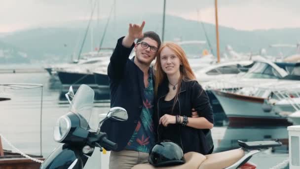 Young Caucasian Couple Standing Scooter Talks Points Far Away Shot — Stock Video