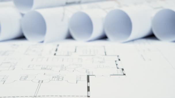 Close-up shot of architectural drawings on table — Stock Video