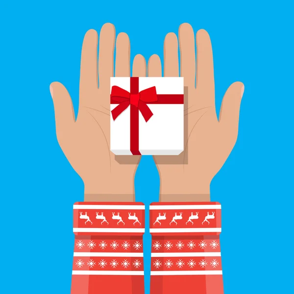 Mão segurando caixa de presente branco com arco vermelho — Vetor de Stock