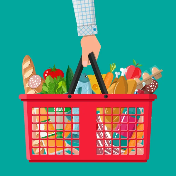 Plastic shopping basket full of groceries products — Stock Vector