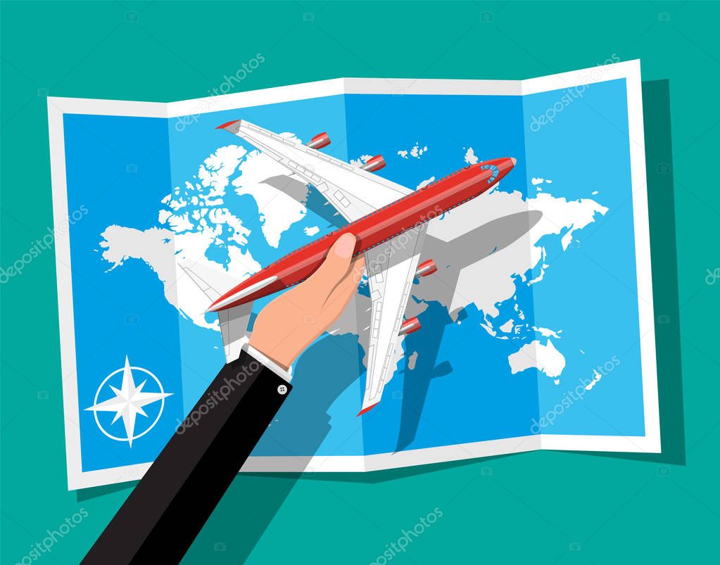 Passenger or commercial jet in hand, map