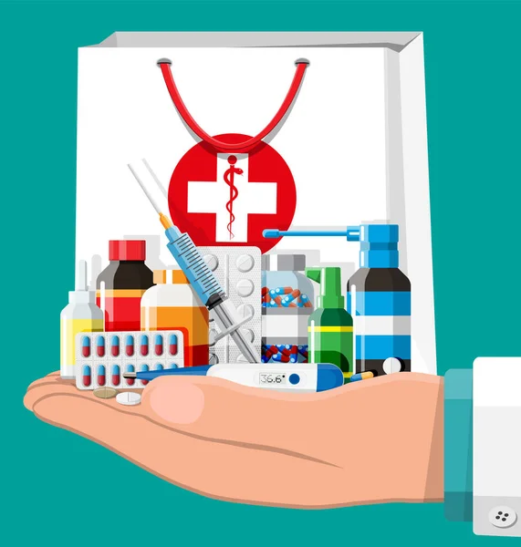 Mano con la colección de medicamentos en bolsa — Vector de stock