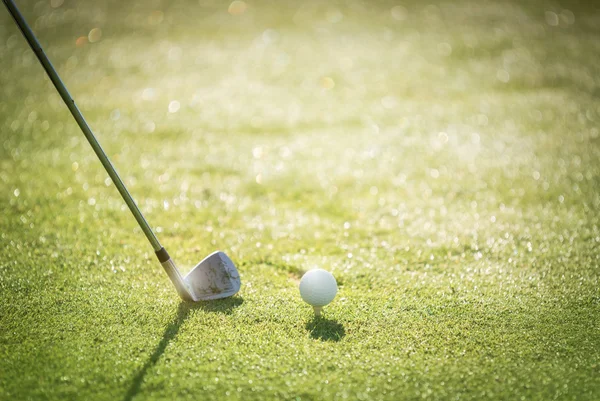 Golfer hitting iron club on golf course on fairway. — Stock Photo, Image