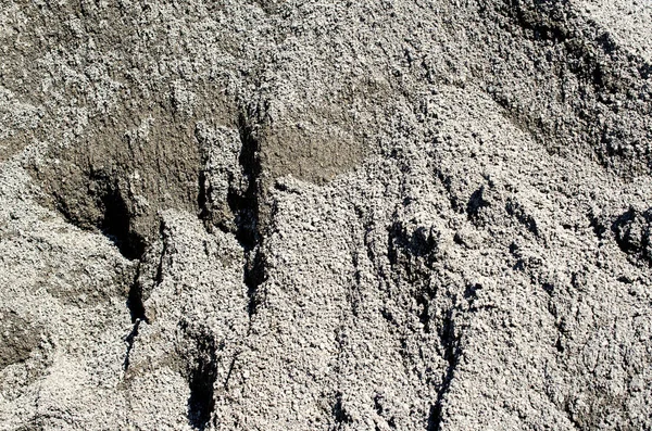 Primo piano di sfondo sabbia grigia / texture . — Foto Stock