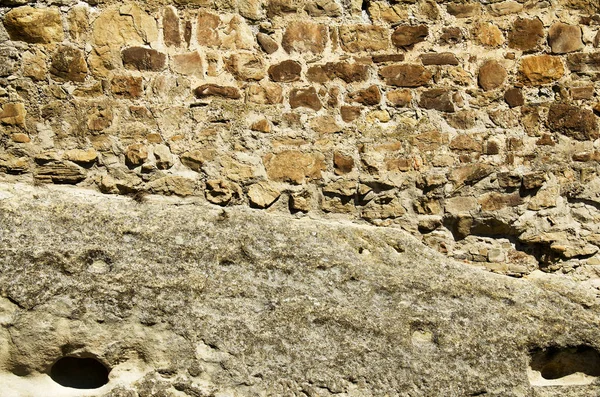 La textura de las piedras viejas junto con el cemento . — Foto de Stock